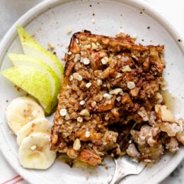 Baked oatmeal is like having dessert for breakfast! Made with healthy ingredients—bananas, pears, oats, nuts and maple syrup, it will leave you satisfied all morning.