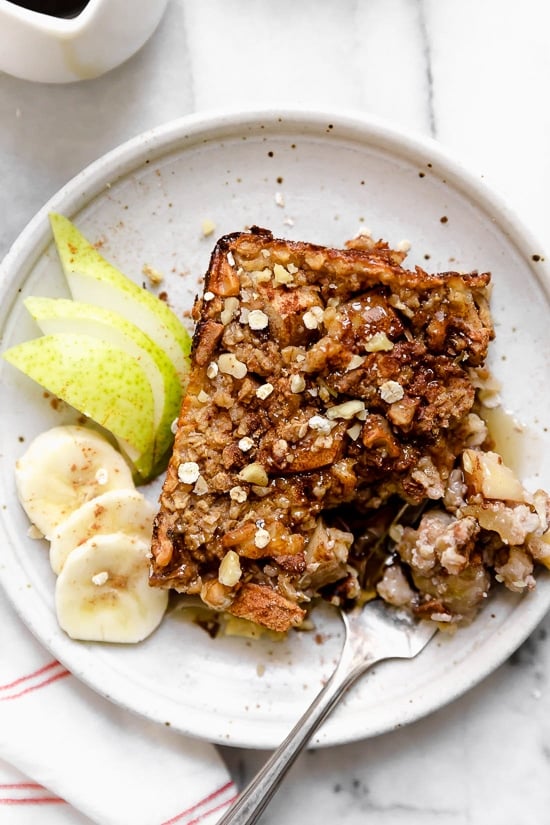 Baked oatmeal is like having dessert for breakfast! Made with healthy ingredients—bananas, pears, oats, nuts and maple syrup, it will leave you satisfied all morning.