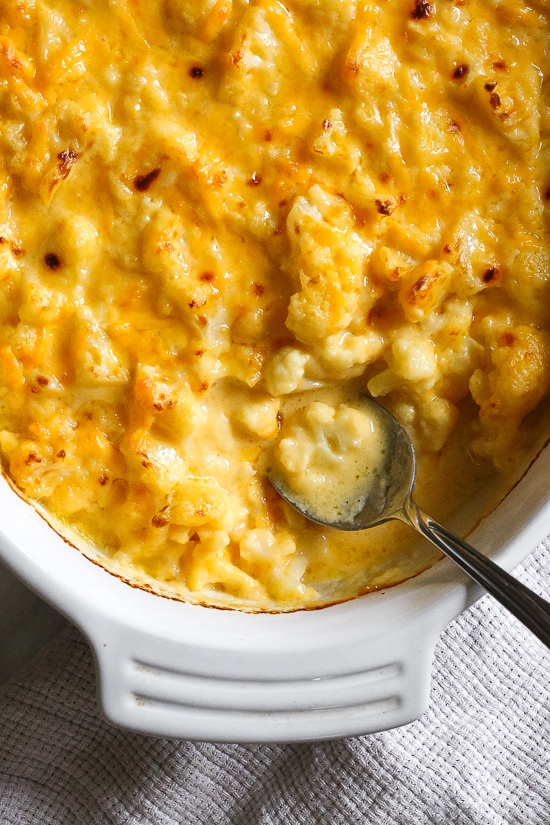 Cheesy Baked Cauliflower "Mac" and Cheese is perfect when you're craving macaroni and cheese–without the pasta! It's lower in carbs and each bowl has a healthy amount of vegetables and protein! Cheesy Baked Cauliflower "Mac" and Cheese is perfect when you're craving macaroni and cheese–without the pasta! It's lower in carbs and each bowl has a healthy amount of vegetables and protein!