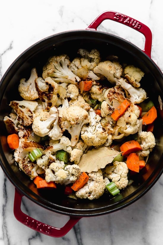 This Creamy Roasted Cauliflower Chowder is comfort food without all the calories. Made with roasted cauliflower, which adds deep, caramelized flavor while keeping the soup a little lighter.