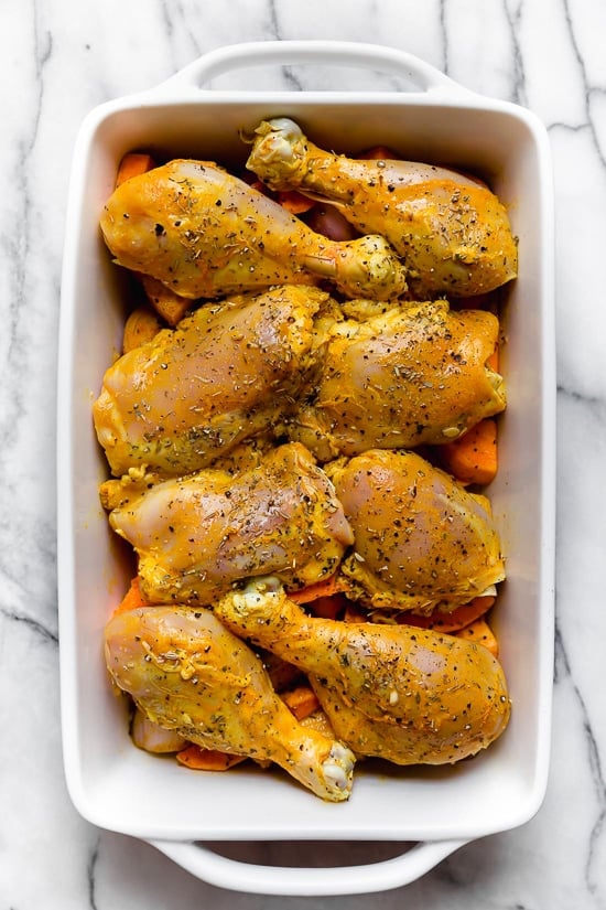 Caramelized sweet potatoes and shallots are the bed for roasted chicken thighs and legs that come together in this one-pot healthy chicken dinner.