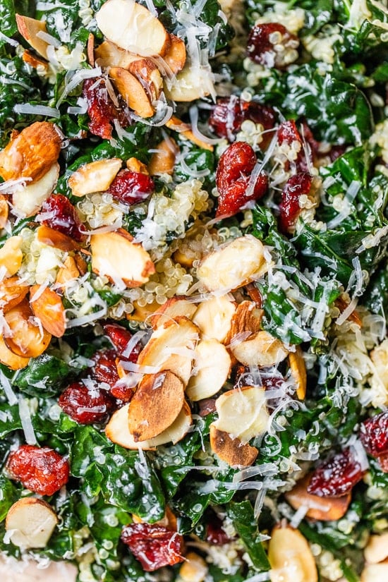 This hearty, fall Kale Salad with Quinoa and Cranberries is made even better by massaging the kale which helps break down the tough cell structure and gives the raw kale a softer texture and gentler flavor. #kalesalad #kale #skinnytaste #massagedkale
