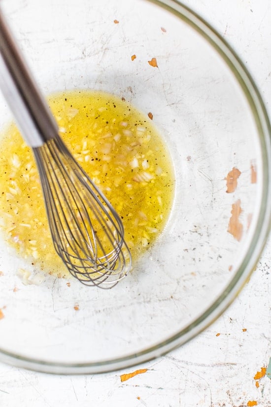 The dressing is a basic vinaigrette made more flavorful with the addition of garlic and shallots and a touch of sweetness from the maple.