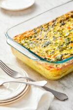 This easy Breakfast Casserole recipe is made with eggs, spinach, tomatoes and Feta cheese and only takes a few minutes to whip up. You can make it ahead of time, so it’s the perfect breakfast egg casserole for Christmas morning or any day!