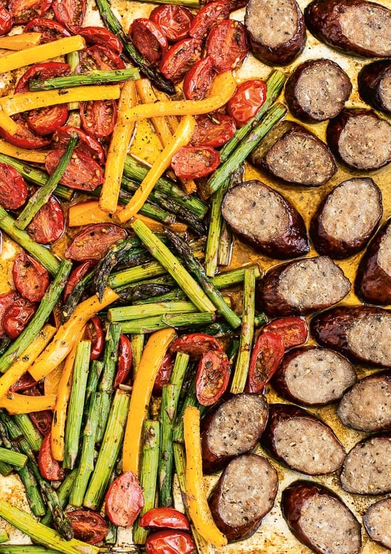 Kielbasa Veggie Sheet Pan Dinner is made with turkey kielbasa, asparagus, tomatoes and bell peppers cooked all on one pan, easy cleanup! It's also Keto, Whole30, Low Carb and Gluten-free.