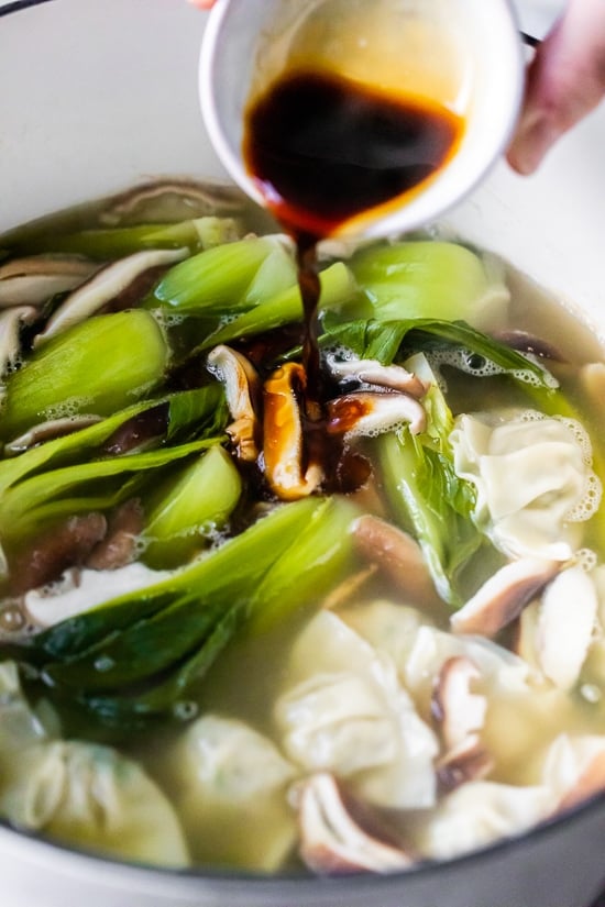 Loaded with vegetables, this quick and easy wonton soup is super simple, and takes under 15 minutes to make thanks to the frozen wontons.