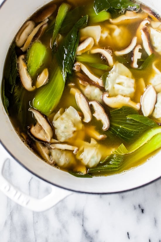 Loaded with vegetables, this quick and easy wonton soup is super simple, and takes under 15 minutes to make thanks to the frozen wontons.