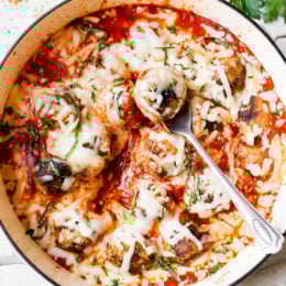 Cheesy Turkey Meatballs covered in sauce and cheese, made all in one skillet, serve this with a green salad and a little bread on the side for dipping!