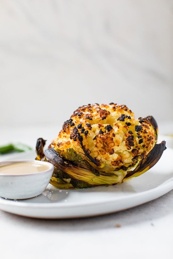 This simple, Whole Roasted Baby Cauliflower is perfectly charred on the outside and tender in the middle. Made with just four ingredients – salted water, extra-virgin olive oil, coarse sea salt—and cauliflower.