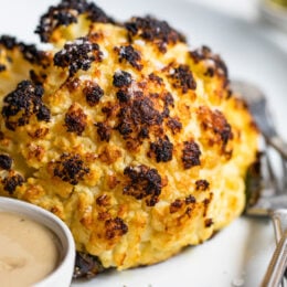 This simple, Whole Roasted Baby Cauliflower is perfectly charred on the outside and tender in the middle. Made with just four ingredients – salted water, extra-virgin olive oil, coarse sea salt—and cauliflower.