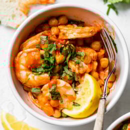 This easy Harissa Shrimp and Chickpea dish is super fast, made all in one skillet, and takes under 10 minutes to make. A great way to use pantry and freezer staples.