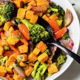 This nourishing Warm Curry Roasted Vegetable Salad with Honey Curry Dressing is a delicious vegetarian, gluten- and dairy-free dinner or make-ahead lunch.