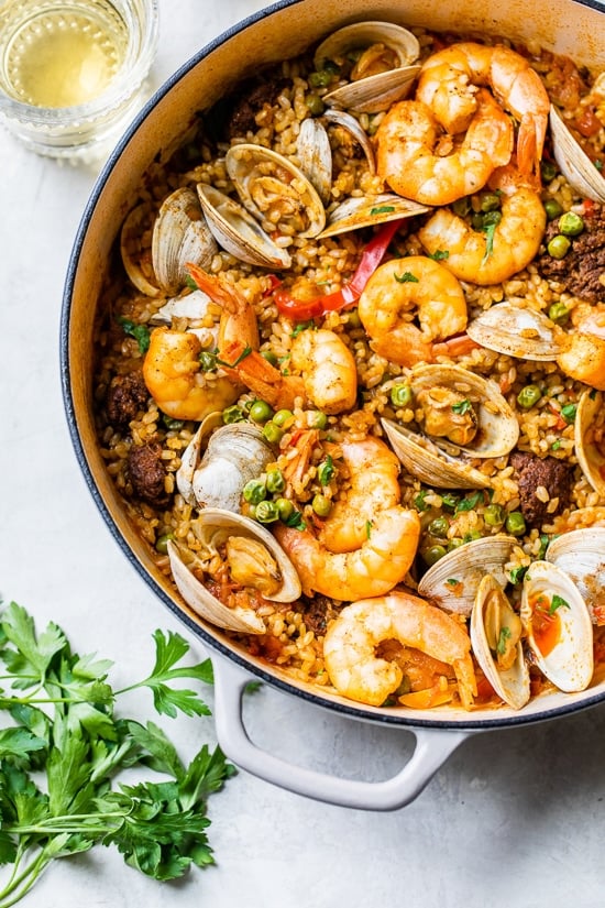 This easy seafood paella, made with shrimp, clams and chorizo is a delicious one-pot dish!