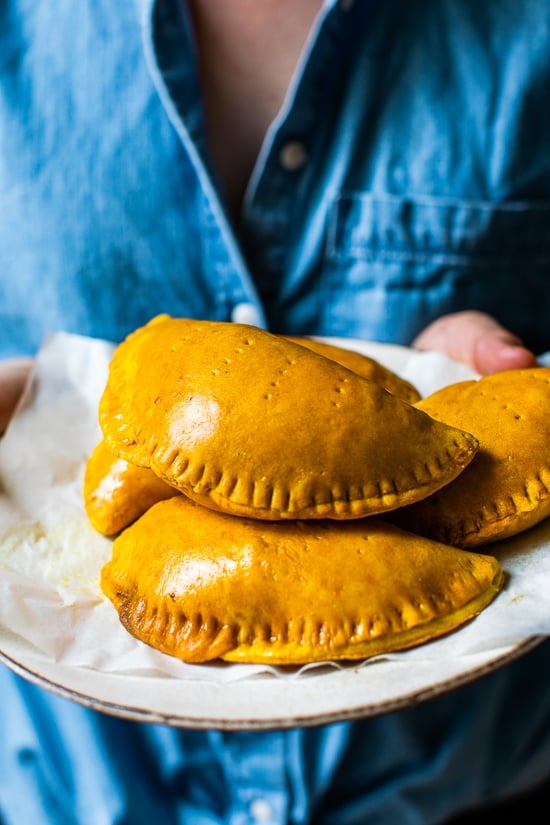 Girl holding Jamaican Beef Patties