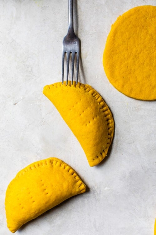 Jamaican Beef Patties with poked fork holes before baking