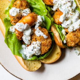 Crispy air fryer shrimp served on a soft potato bun with lettuce and homemade tartar sauce is the perfect summer sandwich.