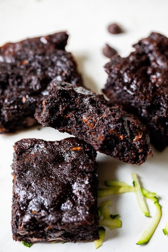 Flourless Zucchini Brownies piled on parchment paper