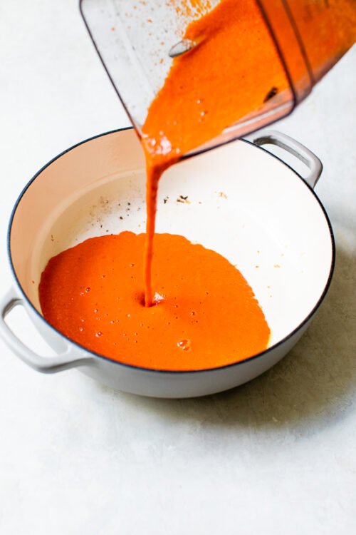 roasted red pepper sauce poured into a pot