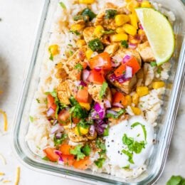 Chicken Taco Poblano Rice Bowls in a glass meal prep container.