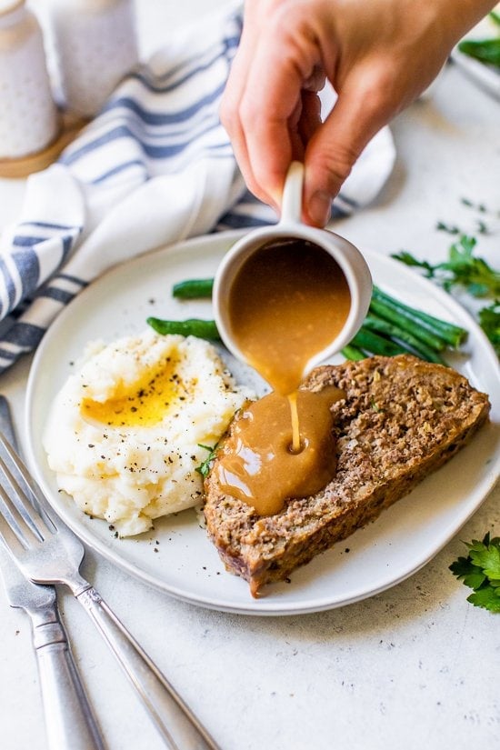 Meatloaf and Gravy with mashed potatoes and green beans.