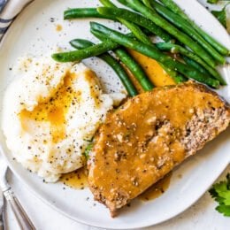 Meatloaf and Gravy with mashed potatoes and green beans.