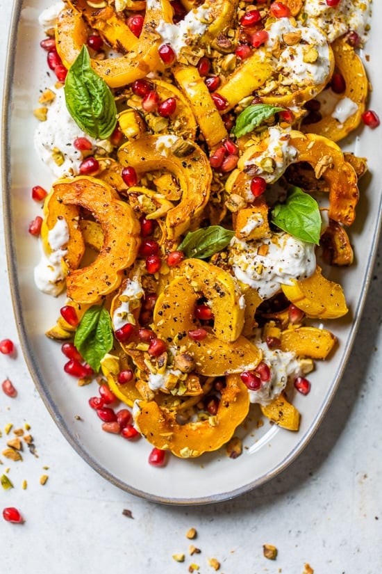 Roasted Delicata Squash with Burrata, Pomegranate and Pistachios