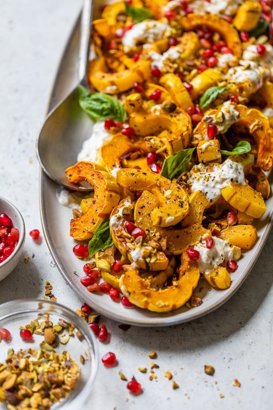 Roasted Delicata Squash with Burrata, Pomegranate and Pistachios