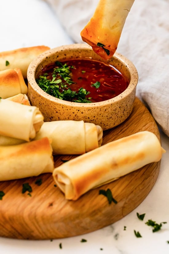 dipping egg rolls in salsa