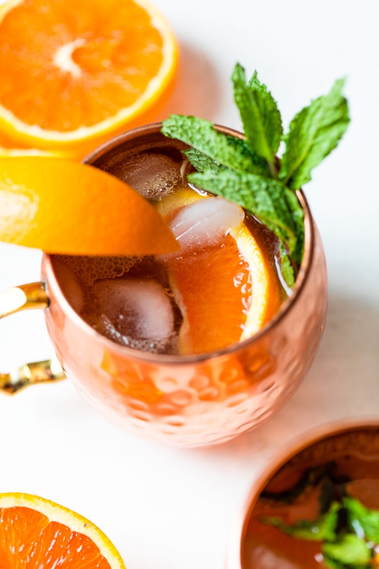 orange moscow mule in copper mugs