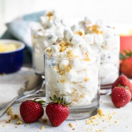 Ambrosia salad in 3 glass serving containers.