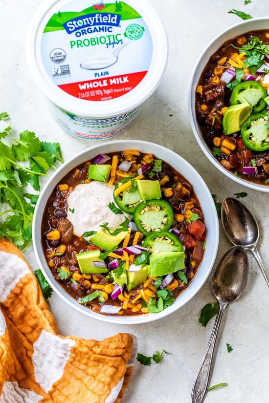 Black Bean Vegetarian Chili topped with yogurt, jalapenos, cheese and avocado.
