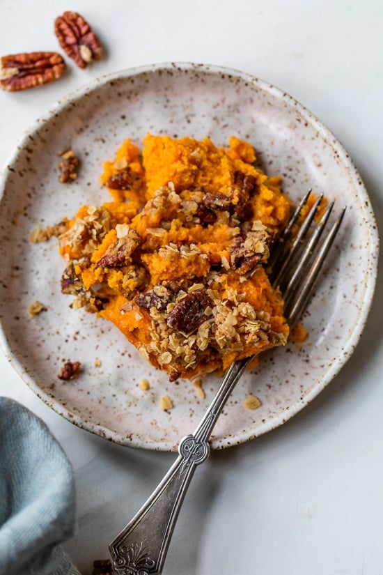 This lightened up Sweet Potato Casserole is made with roasted sweet potatoes and a praline topping for a crowd-pleasing Thanksgiving side! Vanilla Sweet Potatoes