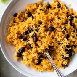 rice and black beans with a fork
