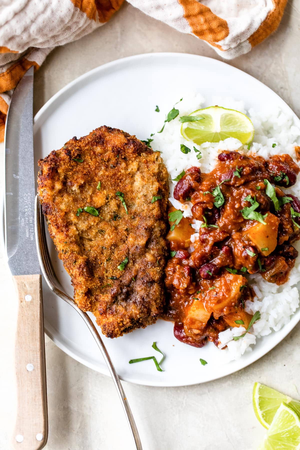 Air Fryer Breaded Cubed Steak with rice and beans.