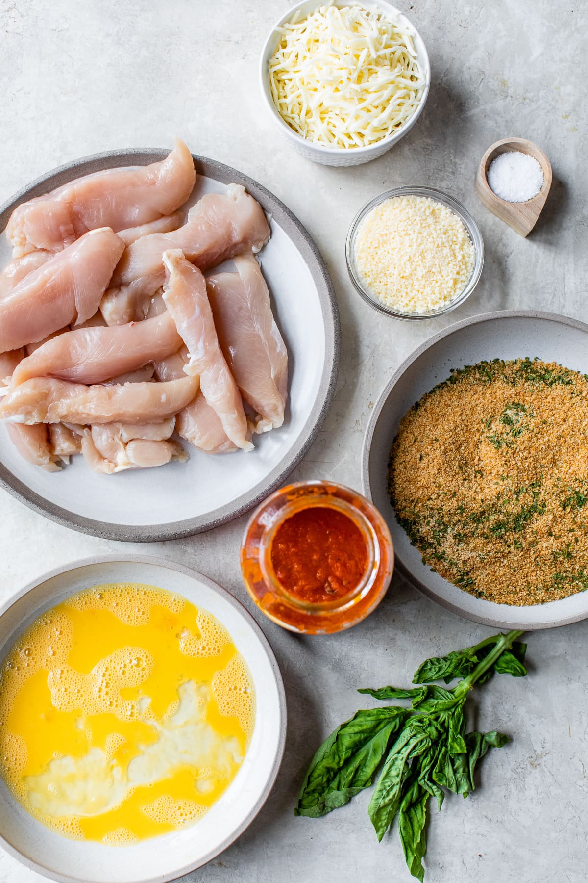 Quick and easy to prepare, this Baked Chicken Tenderloin Parmesan is a family-friendly weeknight dish, prepared with just a few ingredients. Chicken Tenders Parmesan ingredients