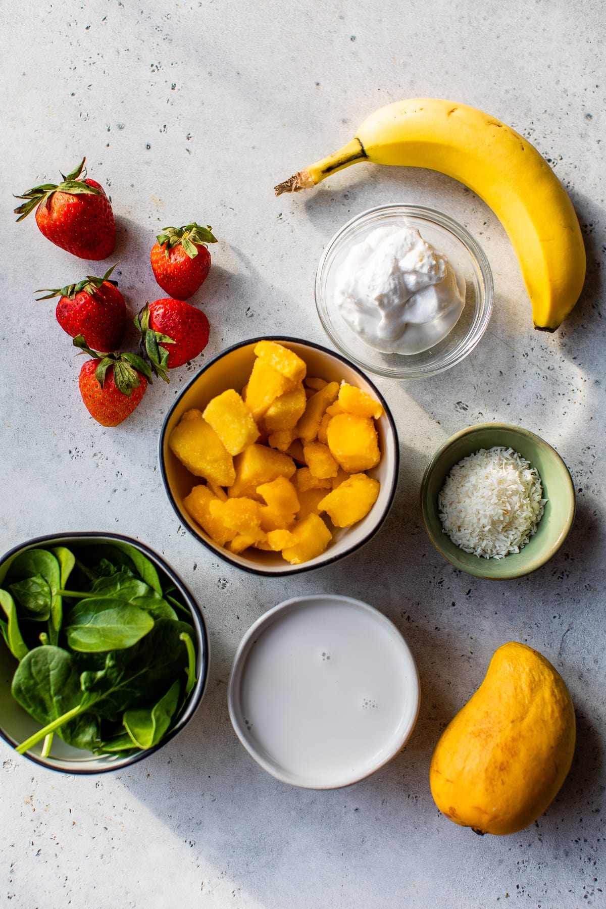 banana, mango, spinach, strawberries, yogurt, coconut.