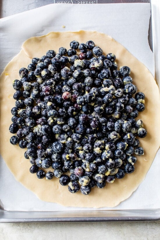 This easy blueberry galette is the perfect dessert to bake when blueberries are in season. Using refrigerated pie dough makes it even faster! how to make a Blueberry Galette