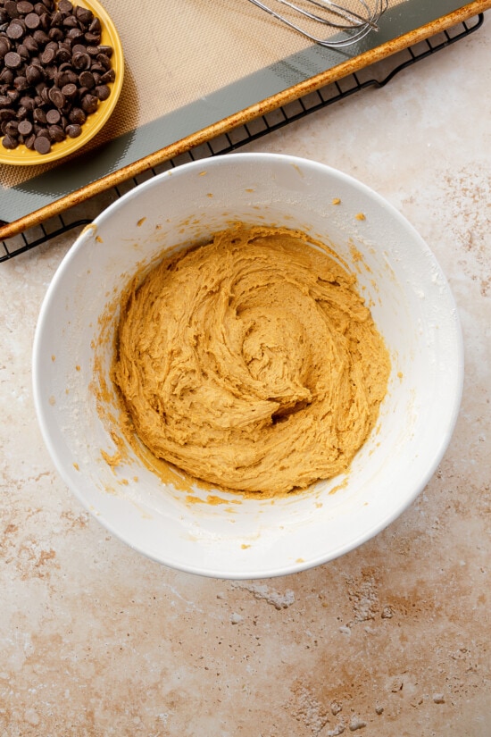 Soft Pumpkin Chocolate Chip Cookies, made with pumpkin puree, pumpkin spice, and cream cheese, have a cake-like texture and pumpkin flavor!