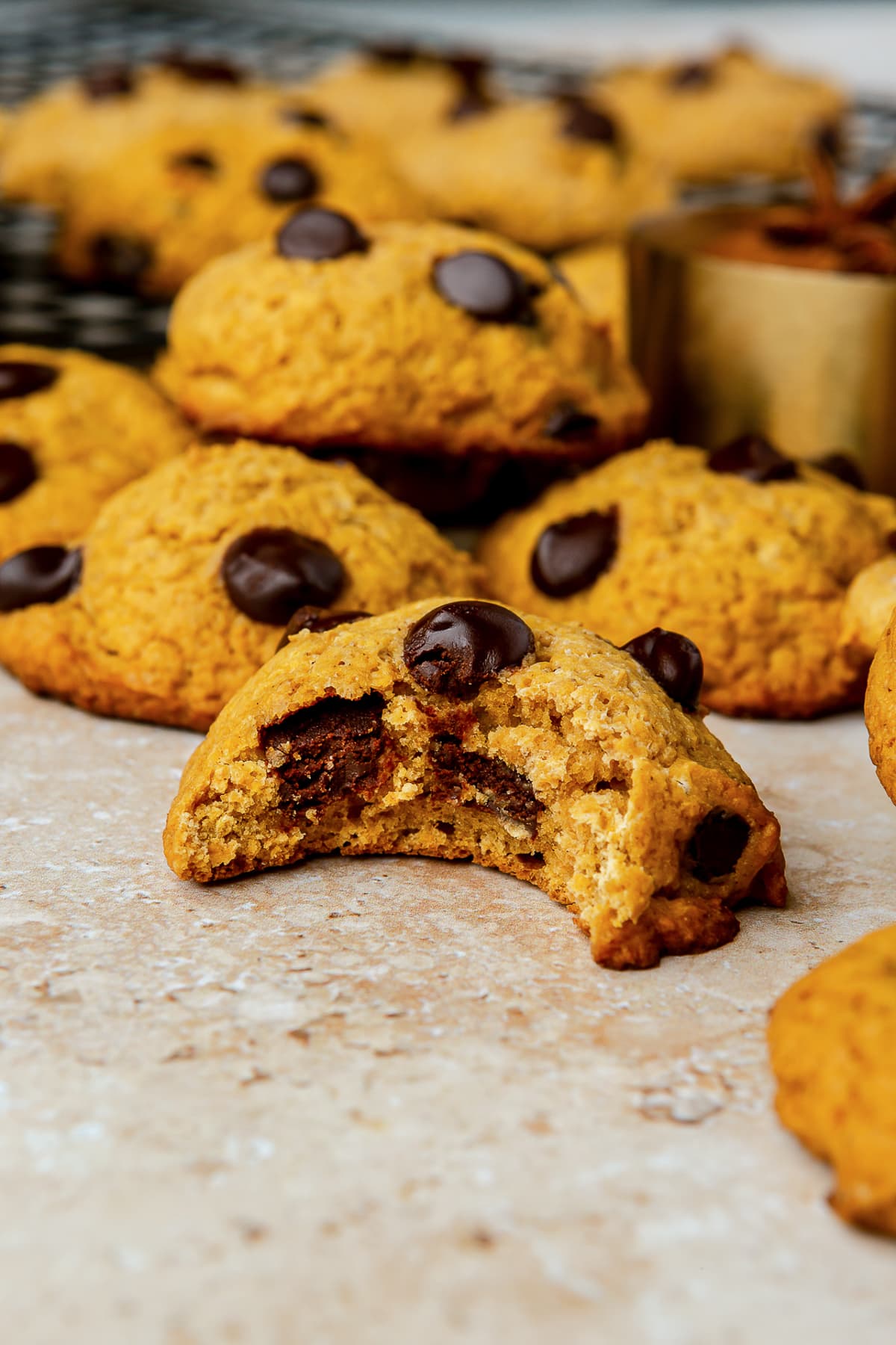 Soft Pumpkin Chocolate Chip Cookies, made with pumpkin puree, pumpkin spice, and cream cheese, have a cake-like texture and pumpkin flavor! Pumpkin Chocolate Chip Cookies