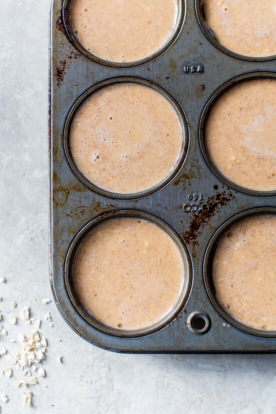 Made with pumpkin puree, oats, pumpkin pie spice, and yogurt, these Pumpkin Baked Oatmeal Cups are an easy breakfast full of fall flavor. Baked pumpkin oatmeal mixture in muffin tins