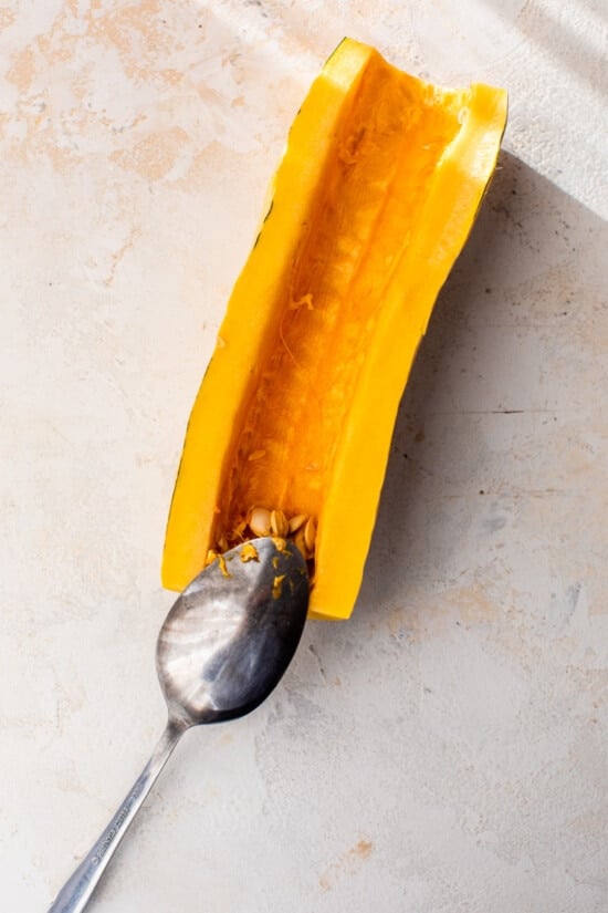 scoop seeds out of delicata squash