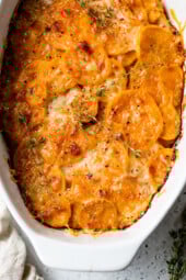 Overhead view of sweet potato gratin in an oval casserole dish.