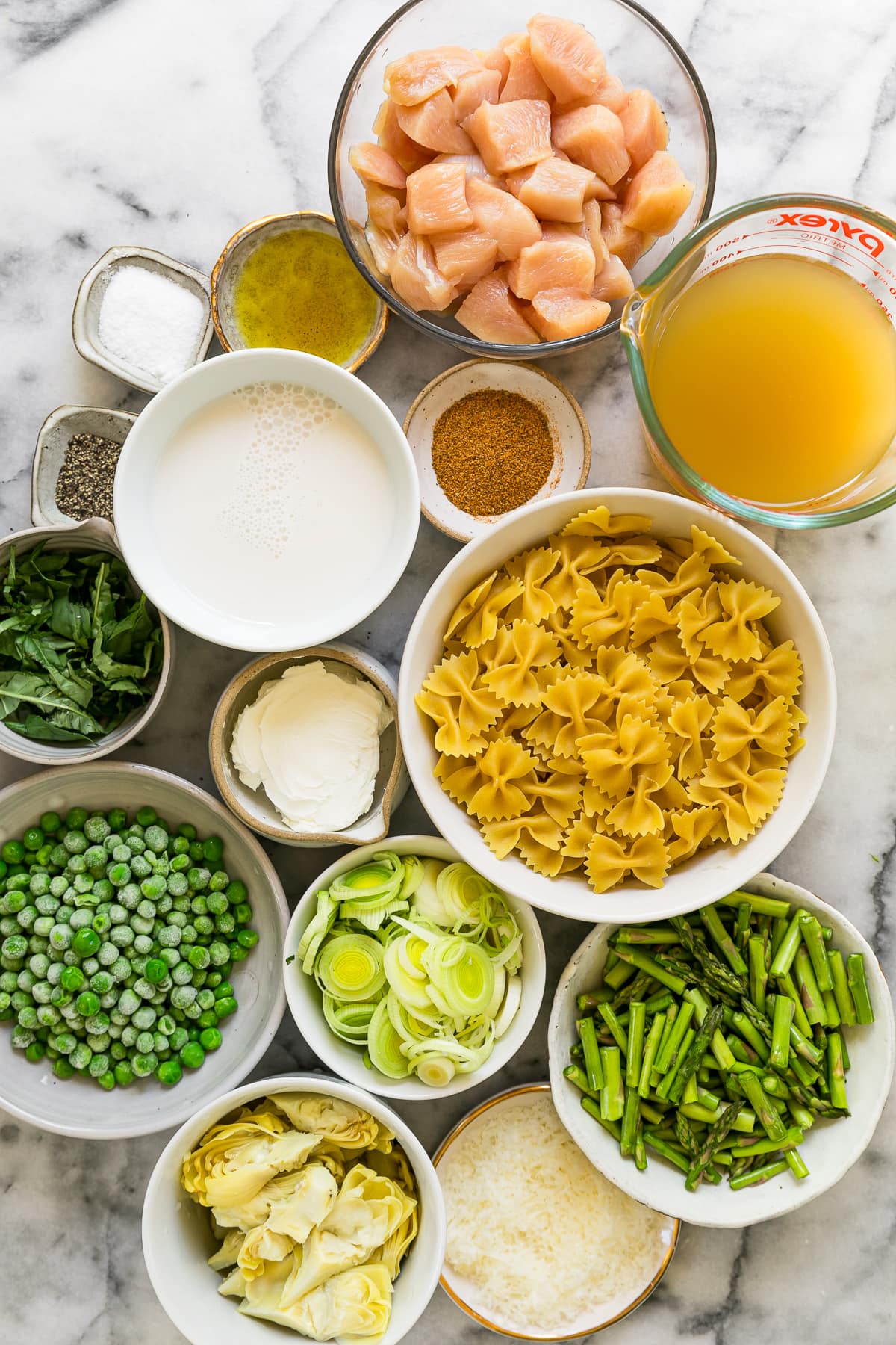 pasta and spring ingredients in bowls
