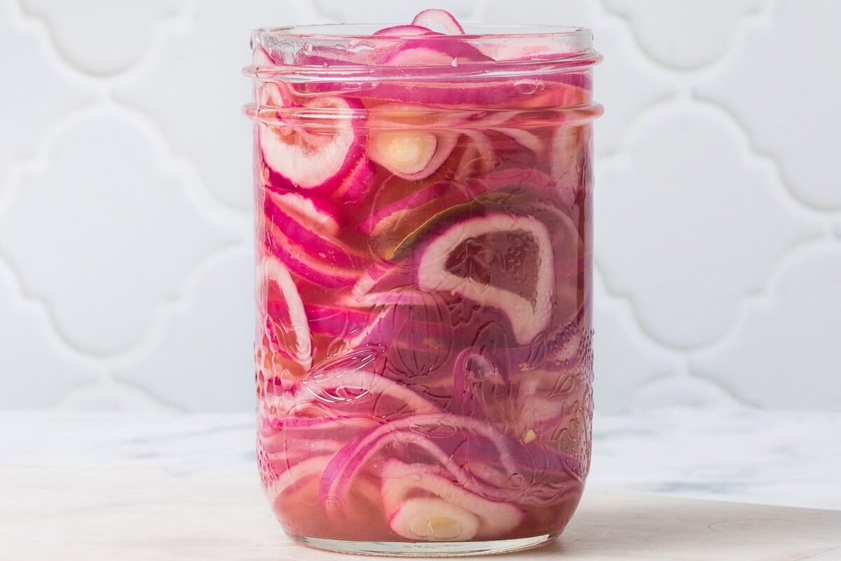 red onions in mason jar
