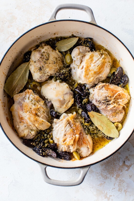 Add the prunes, bay leaves, olives, and capers