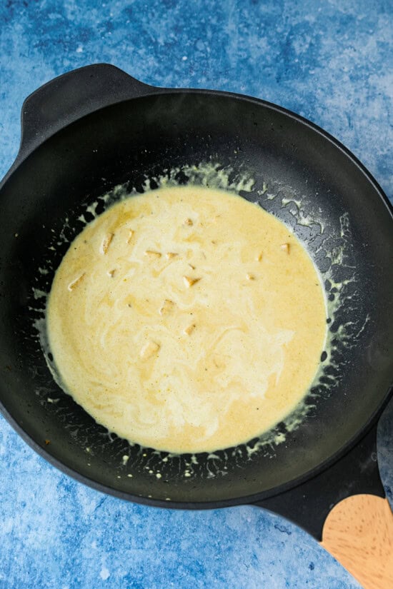 add coconut milk to wok