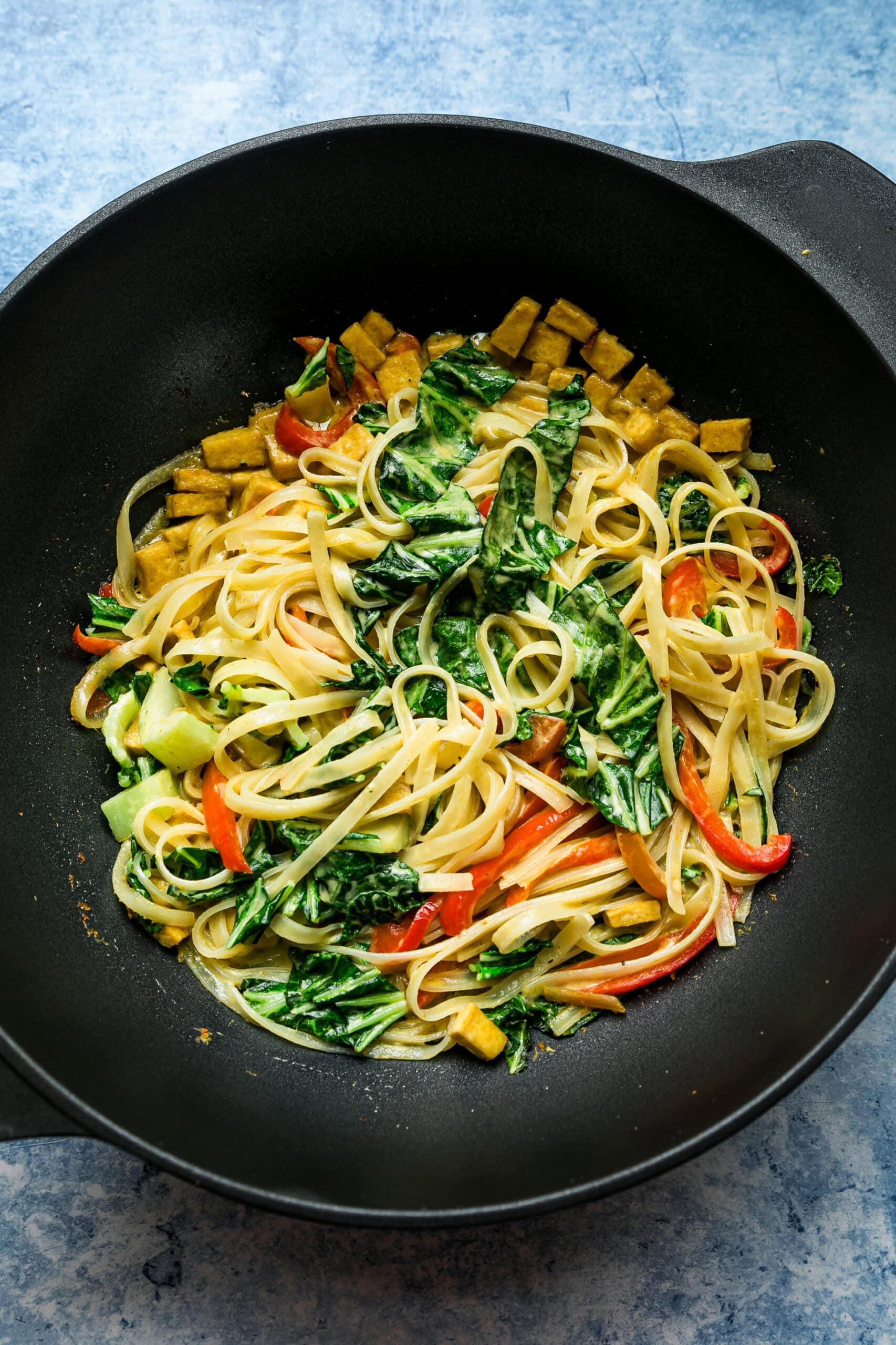 add bok choy and noodles to wok