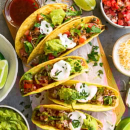 tacos and all the fixins on a board