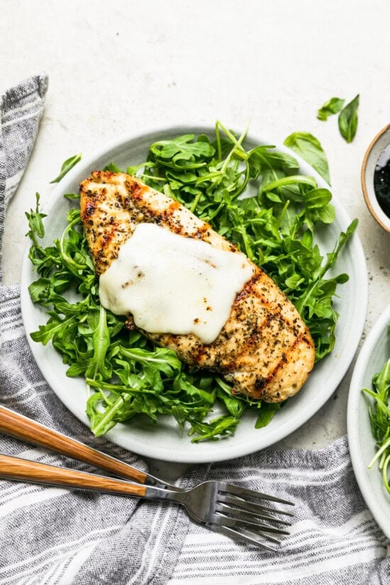 Place chicken on a bed of arugula