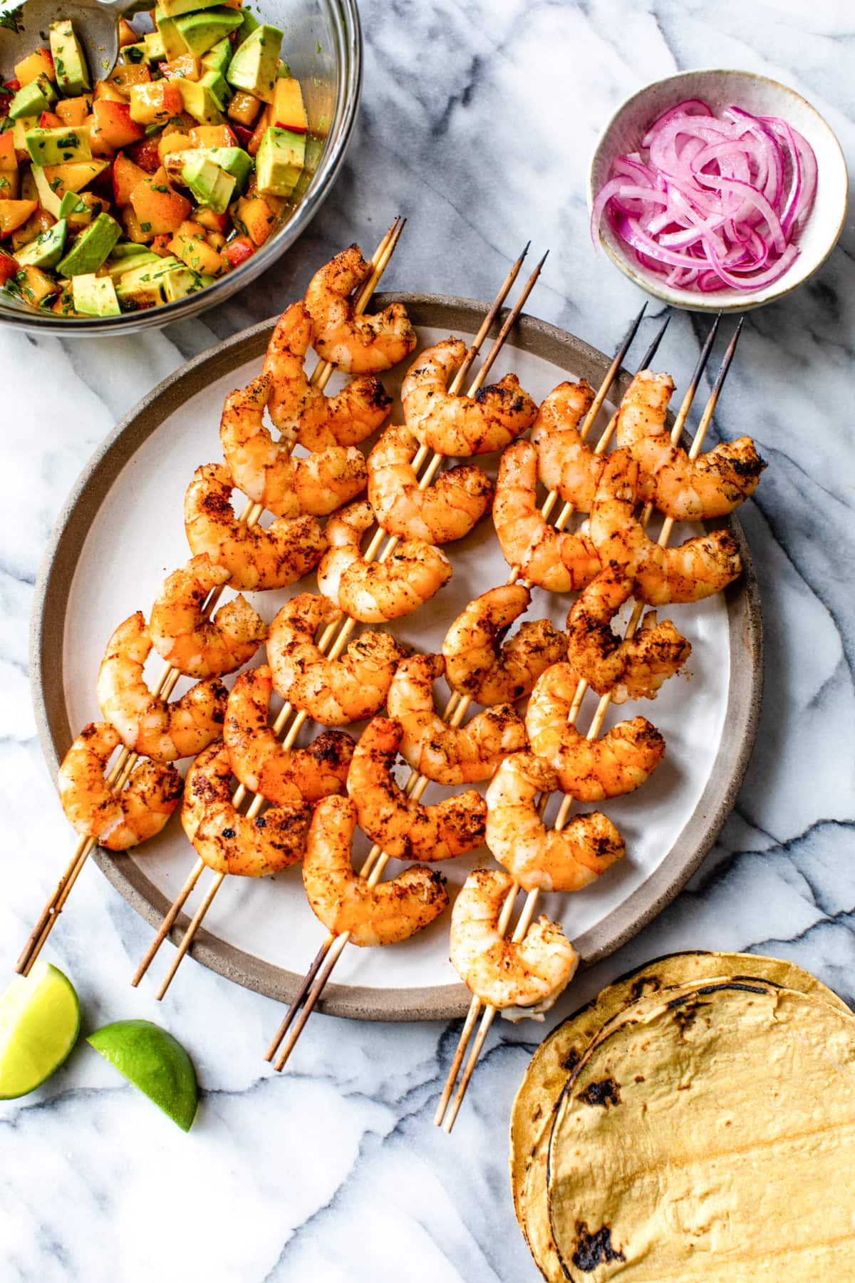 grilled shrimp on skewers with tortillas and peach salsa